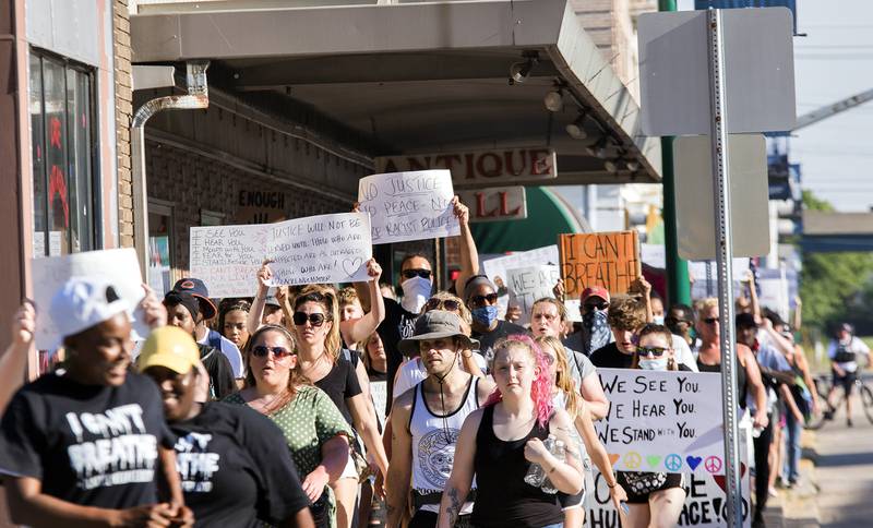 The black lives matter march makes its way along Second Street in downtown Clinton Iowa June 2. The peaceful protest started with speakers near the Riverview Bandshell before marching along the dike and through downtown Clinton. Protesters held signs and chanted while marching. A Police presence made sure protesters and community members stayed safe during the event.
