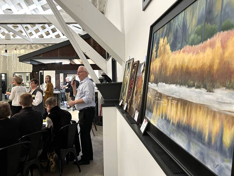 Emcee  James Brown announces a "dasher" number at Serenity Hospice and Home’s Fourth Annual Art Dash fundraiser on Wednesday, April 9, 2025, at River’s Edge Experience, 103 S. First St., Oregon.
