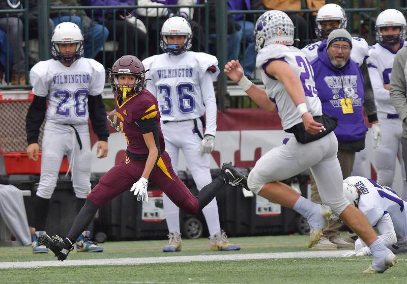 Montini's Santino Florio runs for a first down against Wilmington during a Class 3A semifinal game on November 23, 2024 at Montini Catholic High School in Lombard.