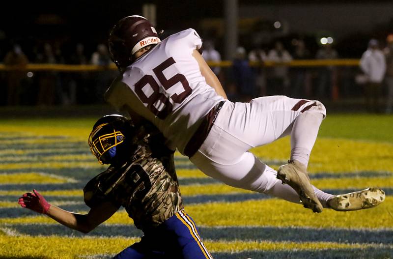 Richmond-Burton's Luke Bresnahan catches a touchdown pass over Johnsburg's Landon Johnson during a Kishwaukee River Conference football game on Friday, Oct.6, 2023, at Johnsburg High School.
