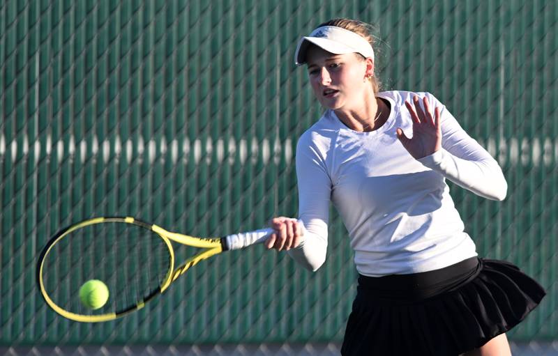 Fenwick’s Lily Brecknock returns the ball during the Class 2A during third-place singles match of the girls state tennis tournament at Hersey High School on Saturday, Oct. 26, 2024 in Arlington Heights.
