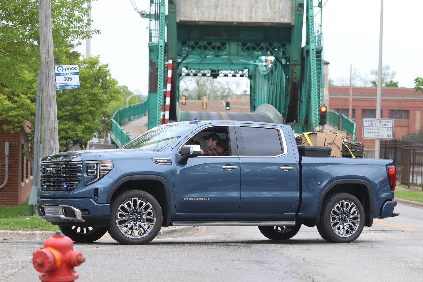 An unmarked police pickup truck turns down North Bluff street during the filming of a scene on Monday, April 27, 2026 in Joliet. HBO began filming the pilot for “American Blue” that follows a police chief retuning to Joliet to take over the police department.