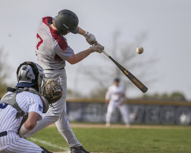 Plainfield North's Gavin Persson (7) connects on a pitch during baseball game between Plainfield North and Oswego East, Monday, April 28, 2025 in Oswego.