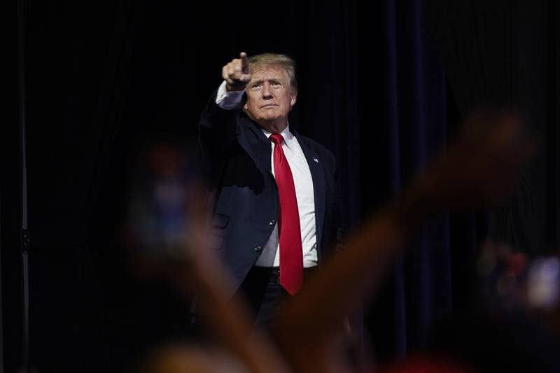 FILE - In this July 24, 2021, file photo, former President Donald Trump points to supporters after speaking at a Turning Point Action gathering, in Phoenix. Reports of hateful and violent speech on Facebook poured in on the night of May 28 after President Donald Trump hit send on a social media post warning that looters who joined protests following Floyd's death last year would be shot, according to internal Facebook documents shared with The Associated Press. (AP Photo/Ross D. Franklin, File)