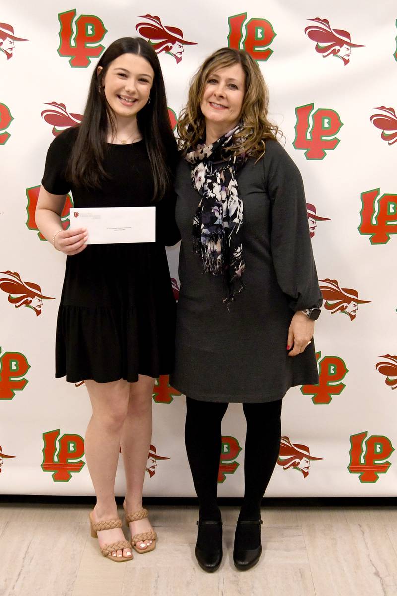 Isabella Argubright (left) received the R. Earl Trobaugh Presidential Scholarship, presented by LPHS English Division Chair Michele Honecker-Ummel. The $275 scholarship is awarded to students who have attained the highest averages in English and foreign language. The recipient must attend Illinois Valley Community College.