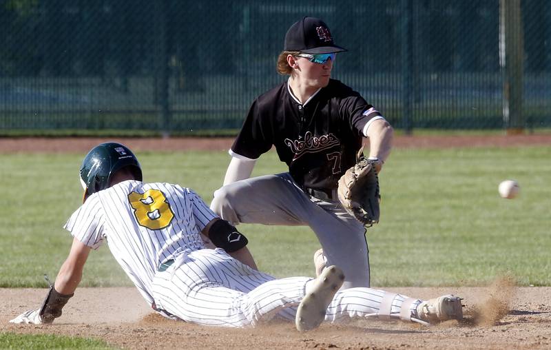 Crystal Lake South's Michael Rathjen slides safely into econd base for a double as Prairie Ridge's Gabe Winkelman waits for the ball during a Fox Valley Conference baseball game on Friday, May 15, 2026, at Crystal Lake South High School.