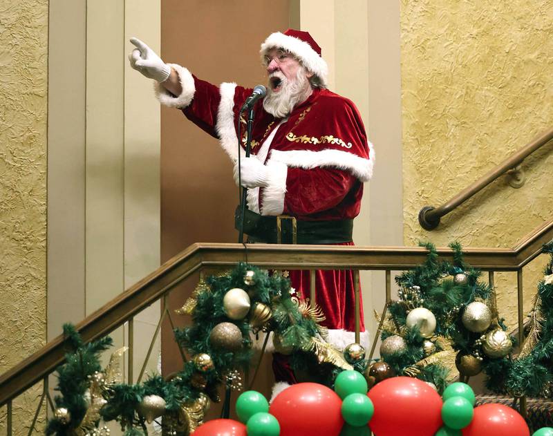 Santa Claus counts down to the lighting of the tree inside the Egyptian Theatre Thursday, Dec. 4, 2025, during the annual Lights on Lincoln and Santa Comes to Town event hosted by the DeKalb Chamber of Commerce.