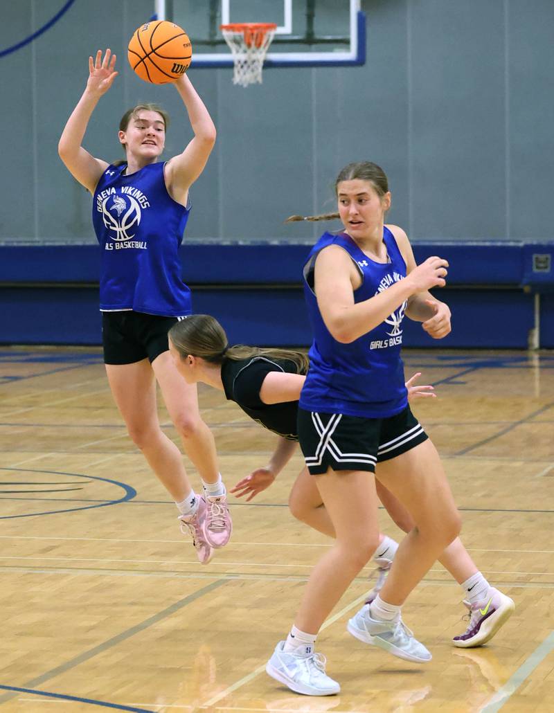 Geneva’s Linnea Popp throws a pass over a Sycamore defender Thursday, June 12, 2025, during their game in the Geneva High School Varsity Summer League.