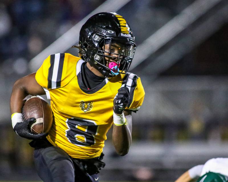 Joliet West's Tai’vaughn Johnson (8) looks for running room during a football game between Plainfield Central at Joliet West on Friday, Oct 25th, 2024  in Joliet.