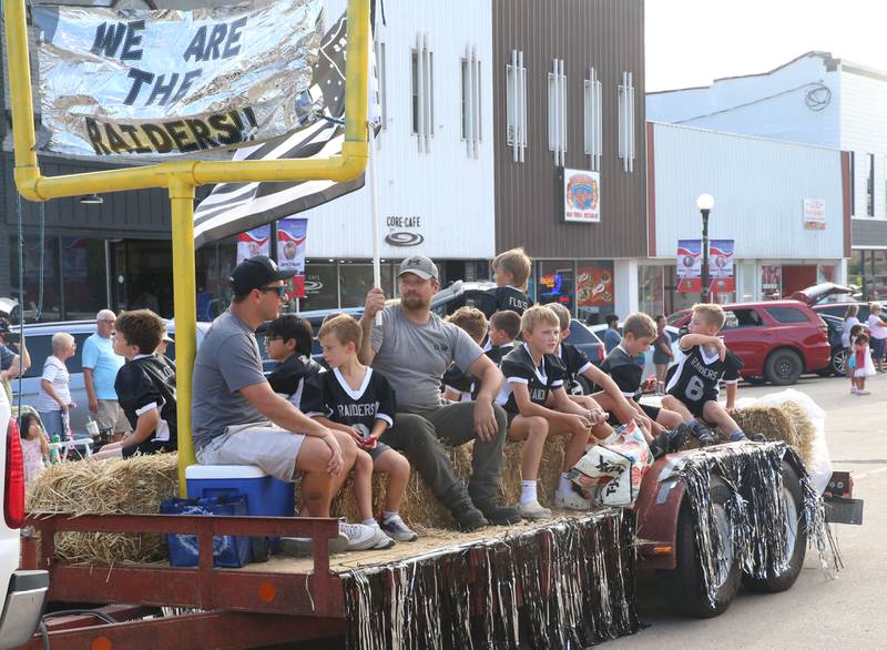 The Raiders flag football team rides during the Homecoming parade on Thursday, Sept. 18, 2025 downtown Spring Valley.