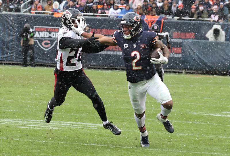 Chicago Bears wide receiver DJ Moore fends off Atlanta Falcons cornerback A.J. Terrell during their game Sunday, Dec. 31, 2023, at Soldier Field in Chicago.