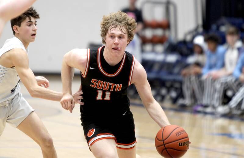 Wheaton Warrenville South’s Colin Moore drives toward the basket during a game at Lake Park in Roselle on Friday, Feb. 10, 2023.