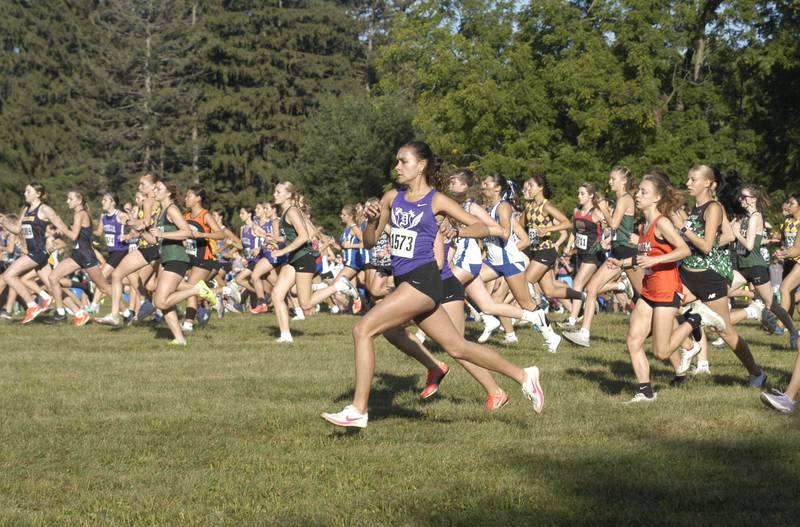 Girl CC runners are off. Local High School teams gathered at Hoover Park in Sterling for the Rock River Run, held on Saturday, September 27, 2025.