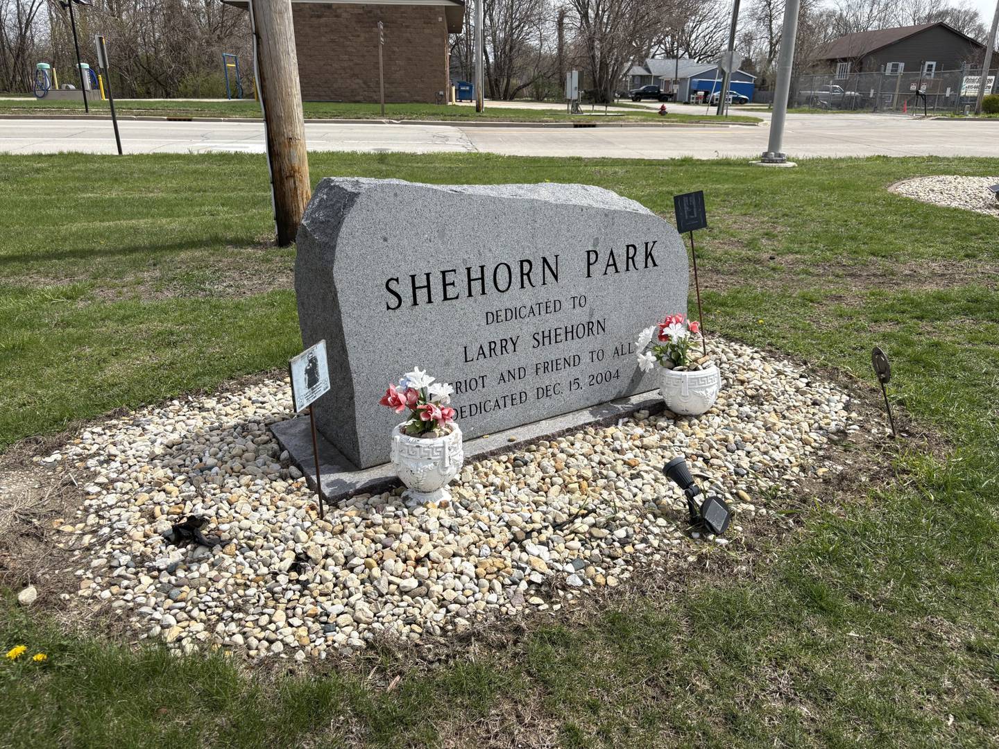A tribute stone honoring the late Larry Shehorn sits near the Middle East Conflicts Wall Memorial in Marseilles. Shehorn, a Vietnam veteran, was known for his commitment to helping others and inspiring community members, including David Raikes.