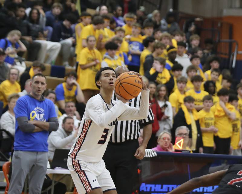 Oswego's Ethan Vahl (3) sizes up a three pointer during their basketball game between Yorkville at Oswego, Feb 7, 2026 in Oswego.