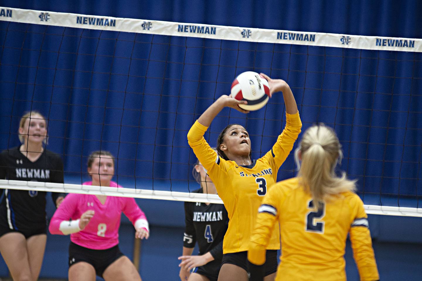 Sterling’s Delali Amankwa sets the ball against Newman Thursday, Aug. 25, 2022.