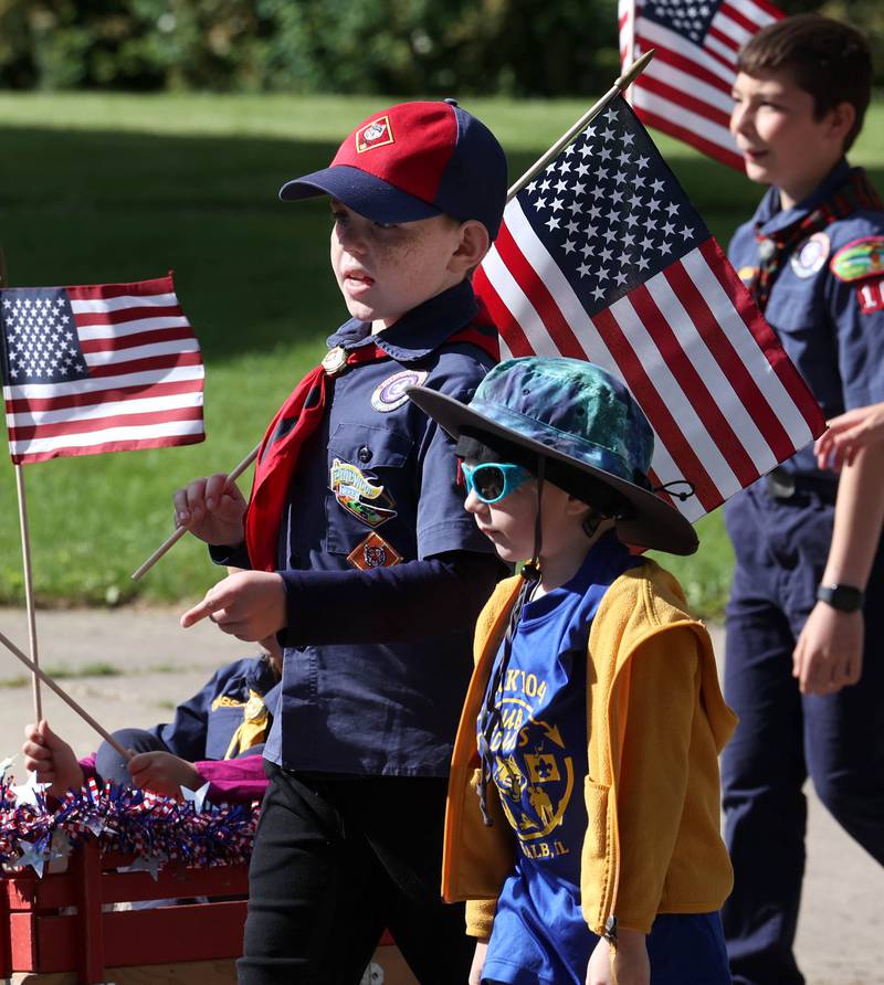 Members of the Cub Scout Pack 131 march Monday, May 26, 2025, in the Memorial Day parade in DeKalb.