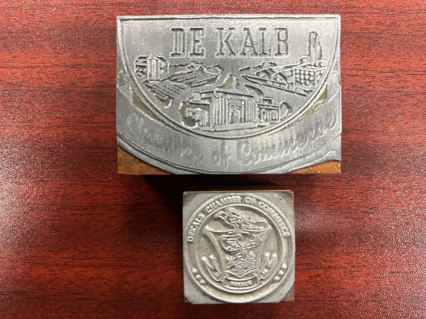 DeKalb Chamber of Commerce memorabilia and historic stamps. (Archive image provided by DeKalb County History Center and Joiner History Room.)