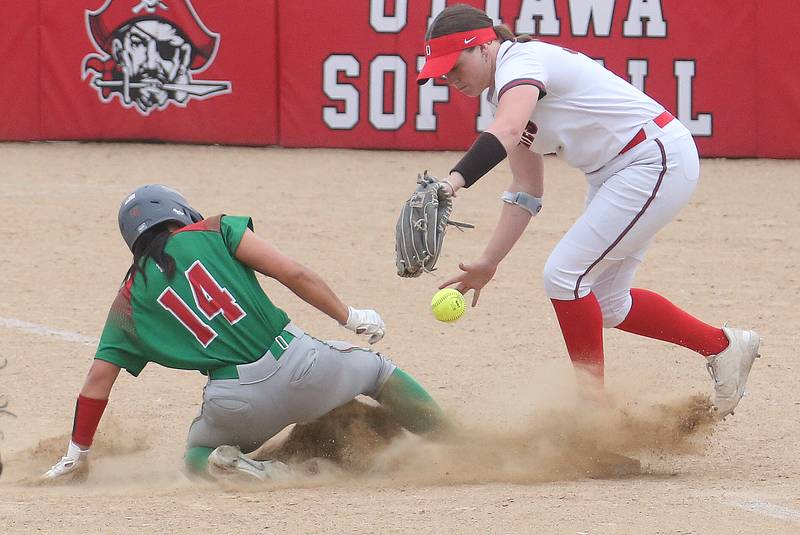 L-P's Ruby Davis slides in safe to third base as Ottawa's third baseman Aubrey Sullivan looses control of the ball on Wednesday, May 7, 2025 at Ottawa High School.