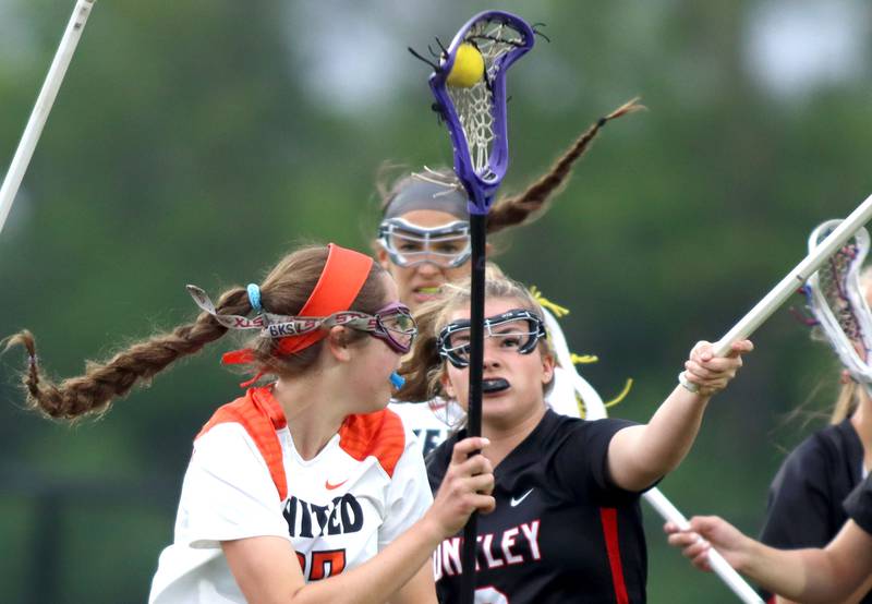 Crystal Lake Central United’s Anna Starr, front, moves the ball as Huntley’s Leah Holmberg defends in IHSA Sectional Title Game action at Crystal Lake Central High School in Crystal Lake on Friday, May 30, 2025.