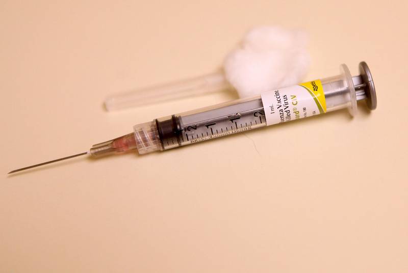 A canine flu vaccination booster shot is shown at Fox Valley Veterinary Clinic in North Aurora in this April 2015 file photo.