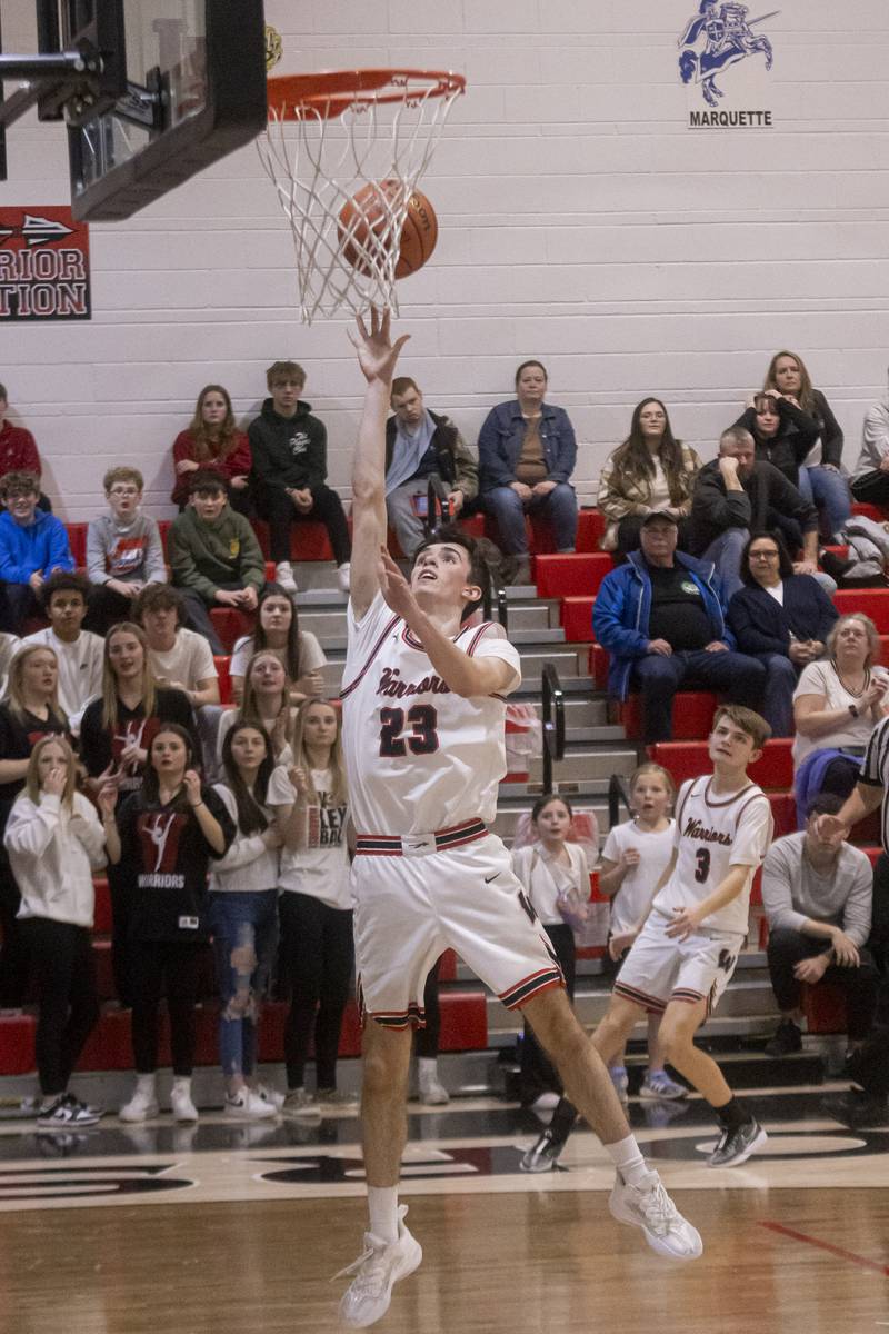 Nick Plesko of Woodland makes a crucial layup in the third quarter to lessen the point deficit against Marquette on January 30, 2024.