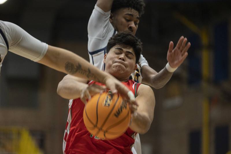 Lasalle-Peru’s Andy Mendia works for a rebound against Sterling’s Kaedon Phillips Tuesday, Jan. 7, 2025, at Sterling High School.
