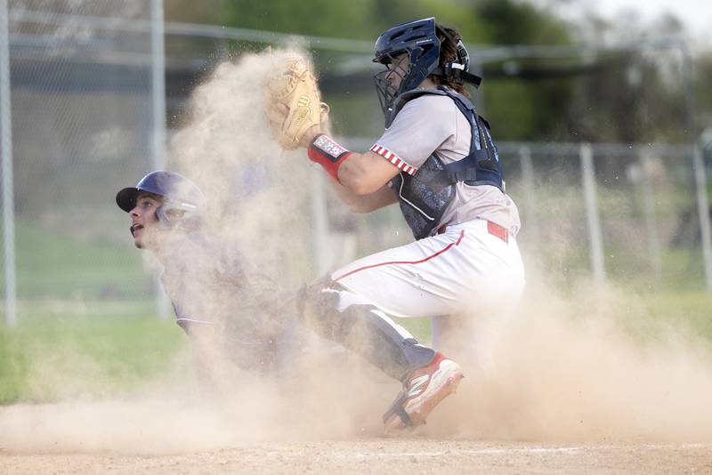 Dixon’s Eli Kirchoff slides at home against Oregon’s Jakobi Donegan Thursday, April 23, 2026.