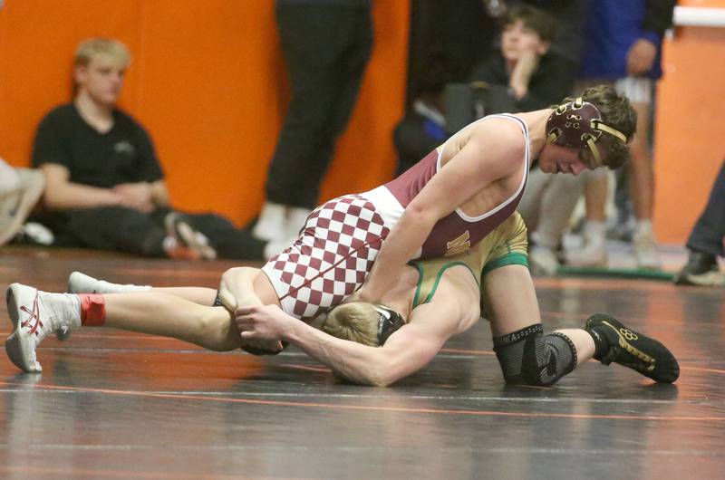 Morris's Brock Claypool wrestles Geneseo's Tim Sebastian in the 126 weight class during the Class 2A Sectional championship on Saturday, Feb. 15, 2025 at Washington High School.