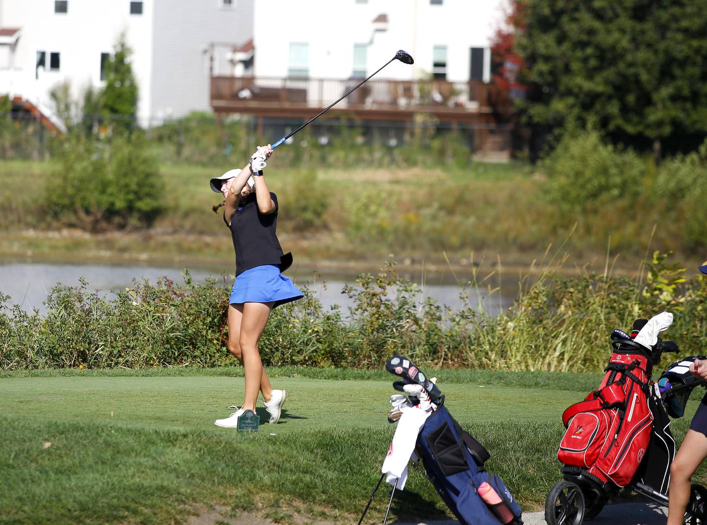 St. Charles North’s Kayla Beu tees off during the Class 2A Waubonsie Valley Girls Golf Sectional on Monday, Oct. 6, 2025 at Springbrook Golf Course in Naperville.