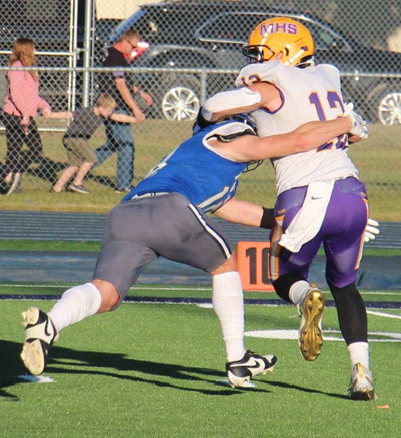 Newman’s Matthew Blackert takes down Mendota quarterback Braiden Freeman Saturday, Sept. 7, 2024, in Sterling.
