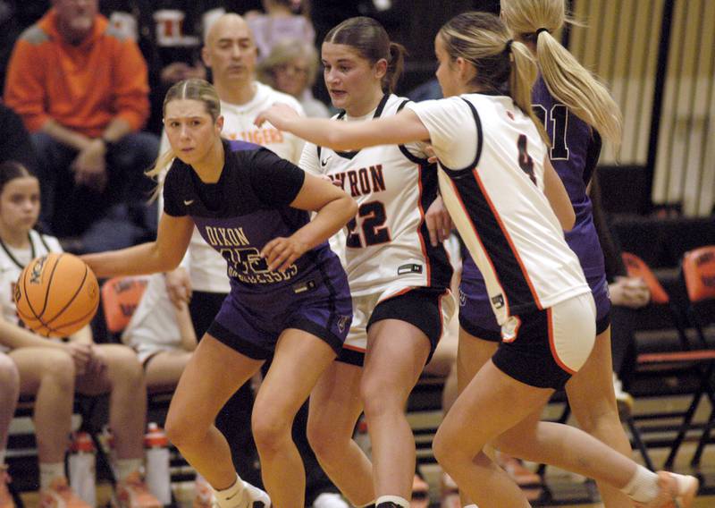 Dixon 's Morgan Hargrave is guarded by Dixon's Aubrie Fuller and Macy Groharing. The Byron Tigers won over the Dixon Duchesses 46-43 in overtime. The girls basketball game took place at Byron on Saturday, January 24th, 2026