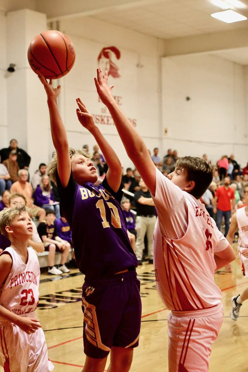 Ohio's Stevie Philbrook shoots over PCA's Jared Zawistowski in Wednesday's game at the Malden Tournament. The Bulldogs won.
