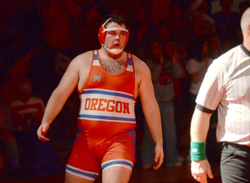 Oregon's Briggs Sellers looks to his teammates after winning his match against Newman's Matthew Murray at the 1A team sectional held Tuesday, Feb. 25, 2025 in the Blackhawk Center in Oregon.