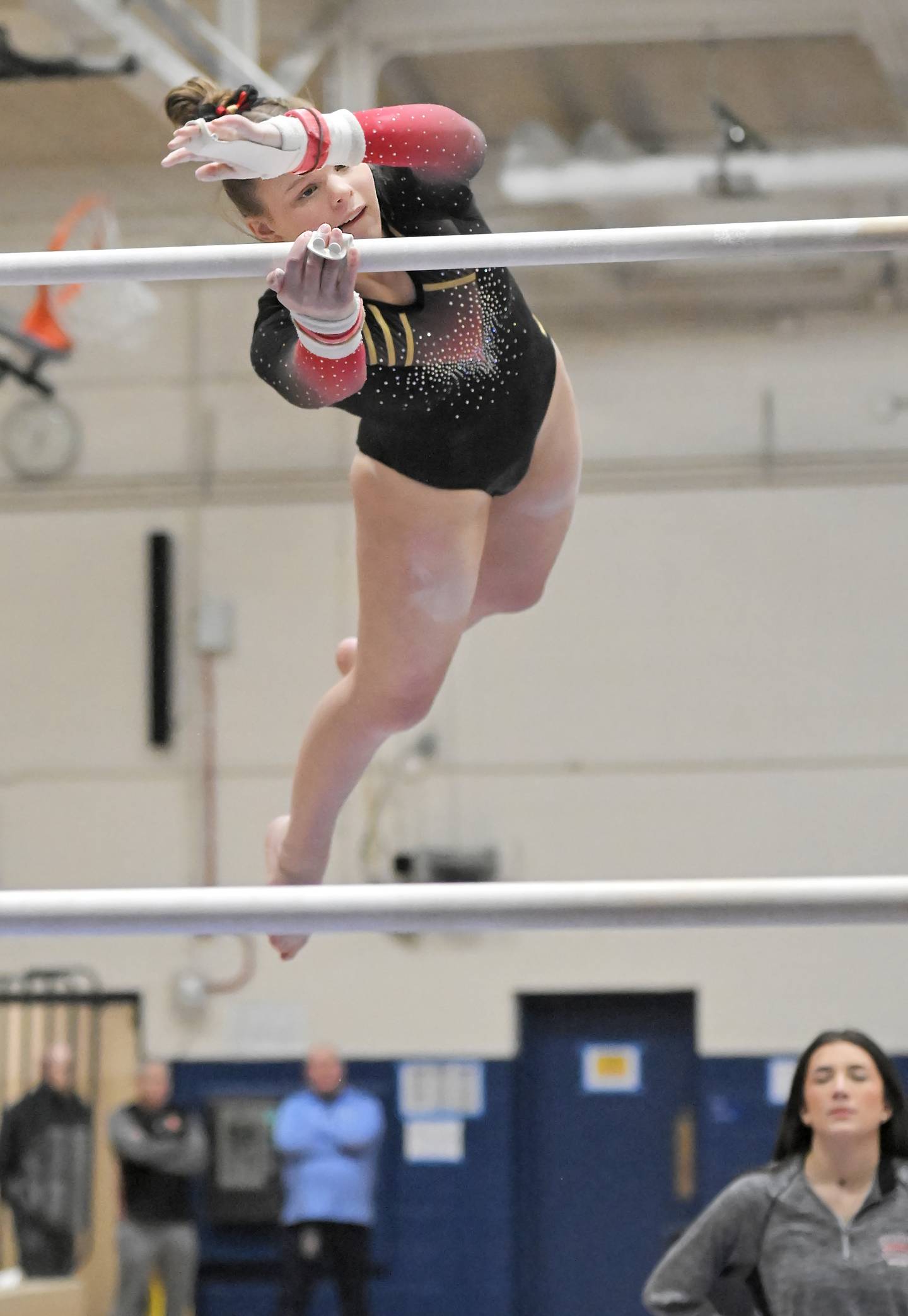 Batavia's Leah Flesch on the uneven bars at the Dukane Conference girls gymnastics regional meet at Lake Park High School in Roselle on Wednesday, Jan. 29, 2025.