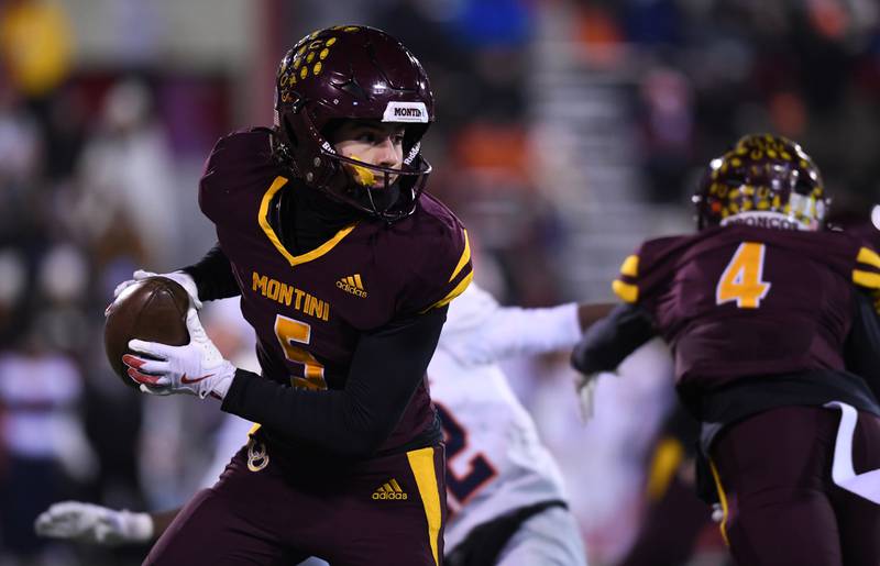Montini's Nico Castaldo turns and looks upfield after catching a pass during the IHSA Class 4A state championship game against Rochester on Friday, Nov. 28, 2025 in Normal.