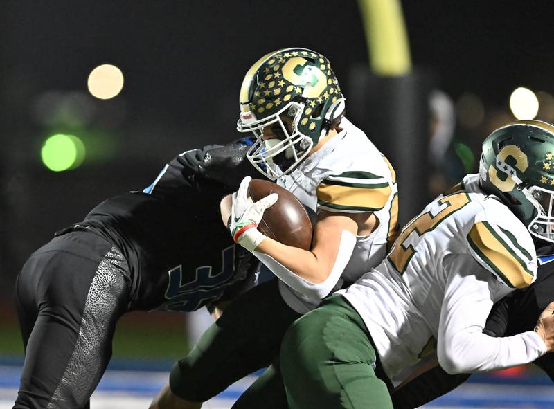 Stevenson's Christopher Thorndyke (23) takes a big hit during the IHSA Class 8A Quarterfinals game against Lincoln-Way East on Friday, Nov. 15, 2024, at Frankfort. (Dean Reid for Shaw Local News)