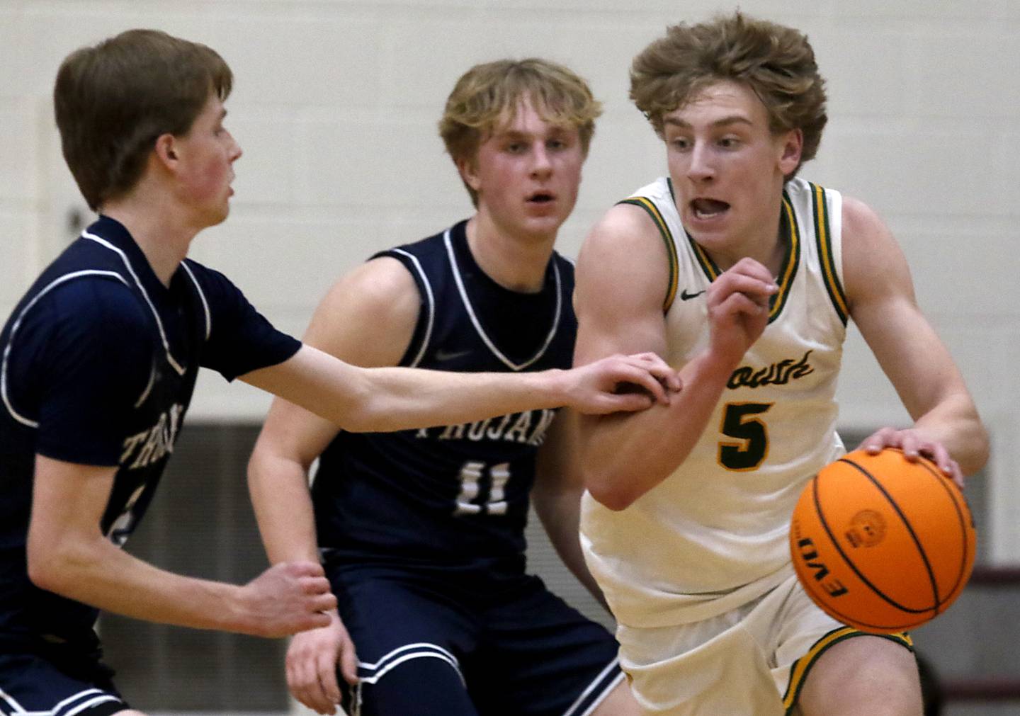 Crystal Lake South's Carson Trivellini (right) dribbles out of the double team of Cary-Grove's AJ Berndt (left) and Landon Nawracaj (center) during the IHSA Class 3A Prairie Ridge Regional championship basketball game on Friday, Feb. 28, 2025, at Prairie Ridge High School in Crystal Lake.