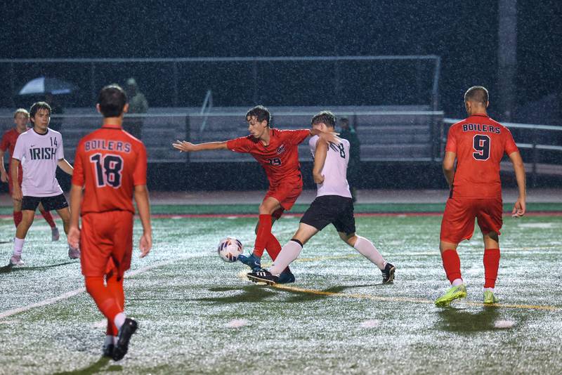 Bradley-Bourbonnais' Jack Martin maintains possession under pressure from Bishop McNamara's Matthew Buzas during the Boilermakers' 9-0 victory over Bishop McNamara in an All-City match up on Wednesday, Sept. 3, 2025.
