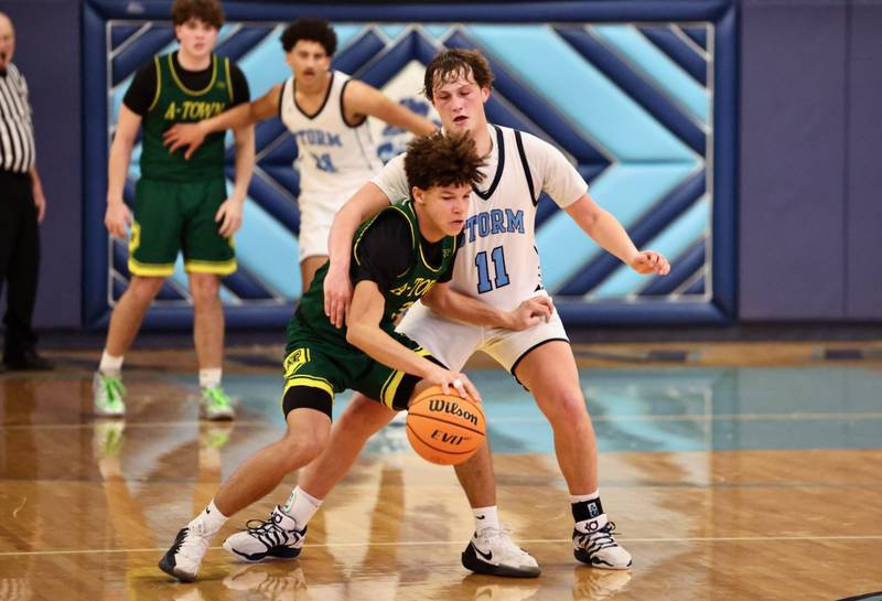 Bureau Valley's Blake Foster applies some defense against Abingdon-Avon Friday night at the Storm Cellar. A-Town won 47-45.