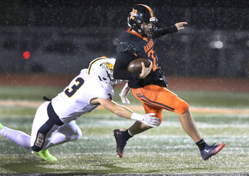 DeKalb's Adrien McVicar tries to pull away from Neuqua Valley's Josh Wenz during their game Friday, Oct.14, 2022, at DeKalb High School.