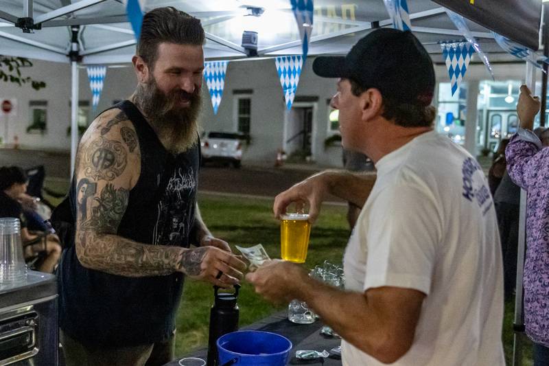 Man purchases a beer from tent on Saturday, October 5, 2024 at Rotary Park in Princeton.
