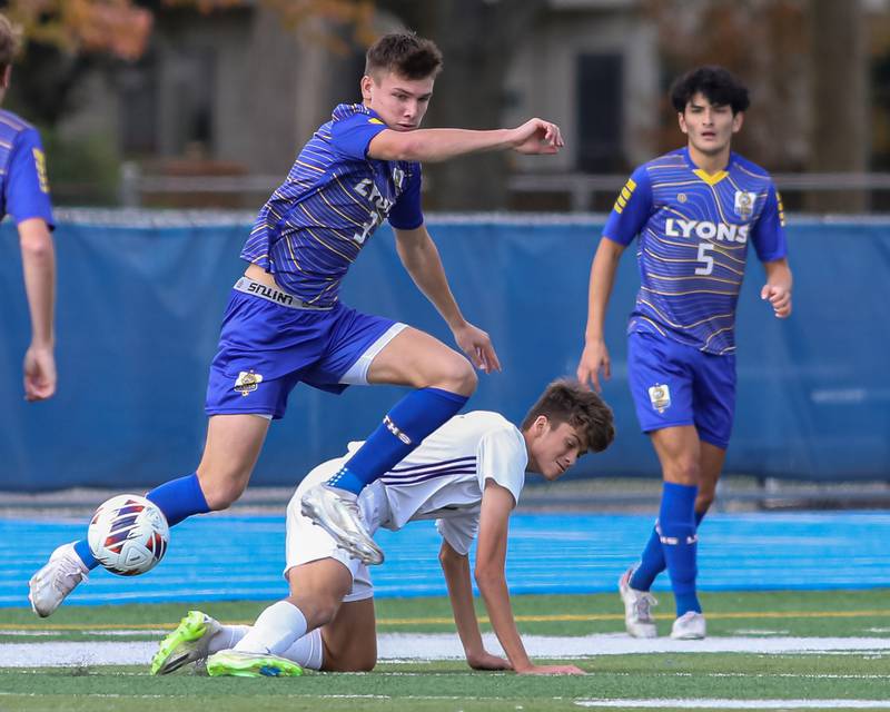 Lyons Collin Sullivn (3) avoids a collision while advancing the ball during Class 3A Lyons Regional final soccer match.  Oct 21, 2023.