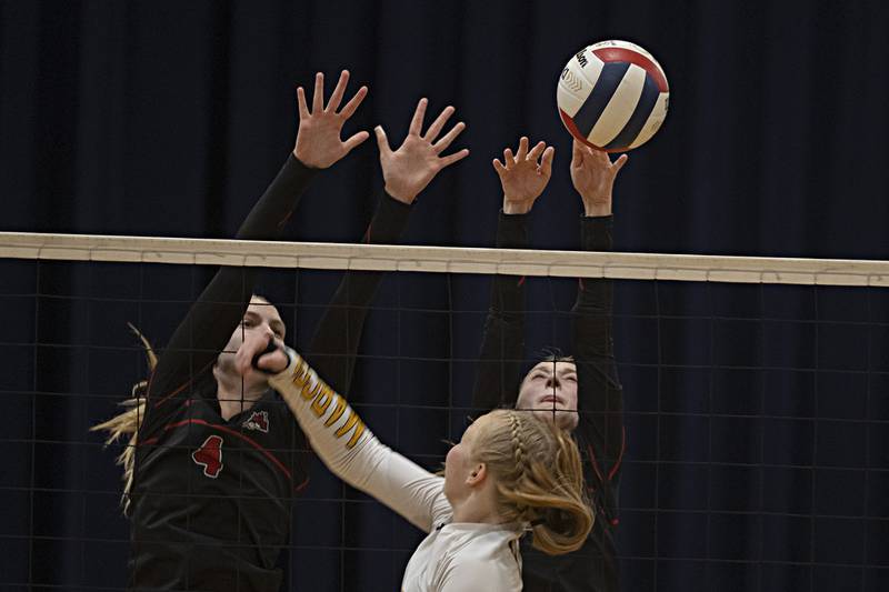 Fulton’s Ava Bowen (left) and Kali Brewer go up top block a shot by Polo’s Camrynn Jones Thursday, Sept. 14, 2023 in Polo.