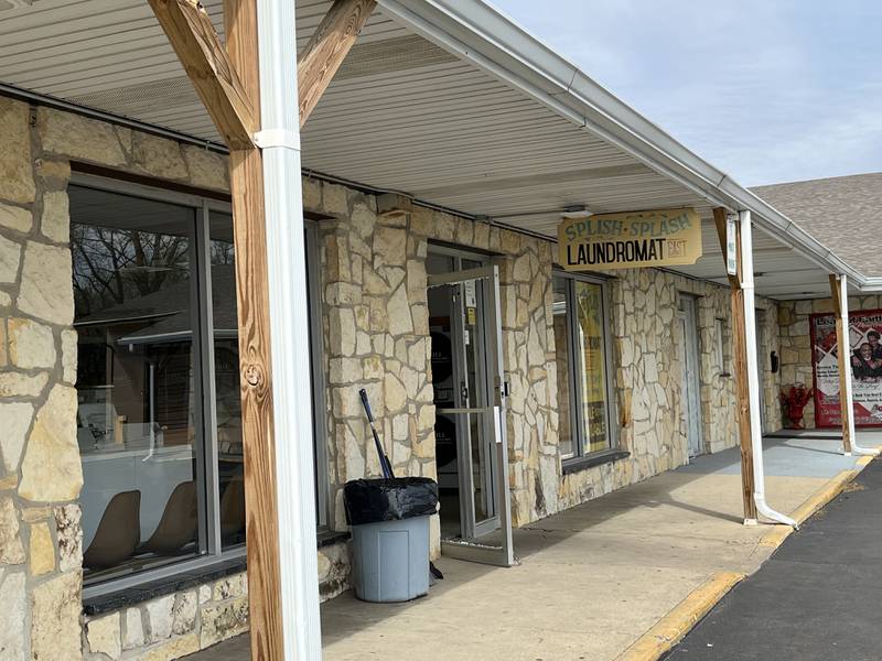 The glass entrance to Splish Splash Laundromat, 1220 Richards St., was damaged by gunfire on Thursday, April 18, in Joliet.