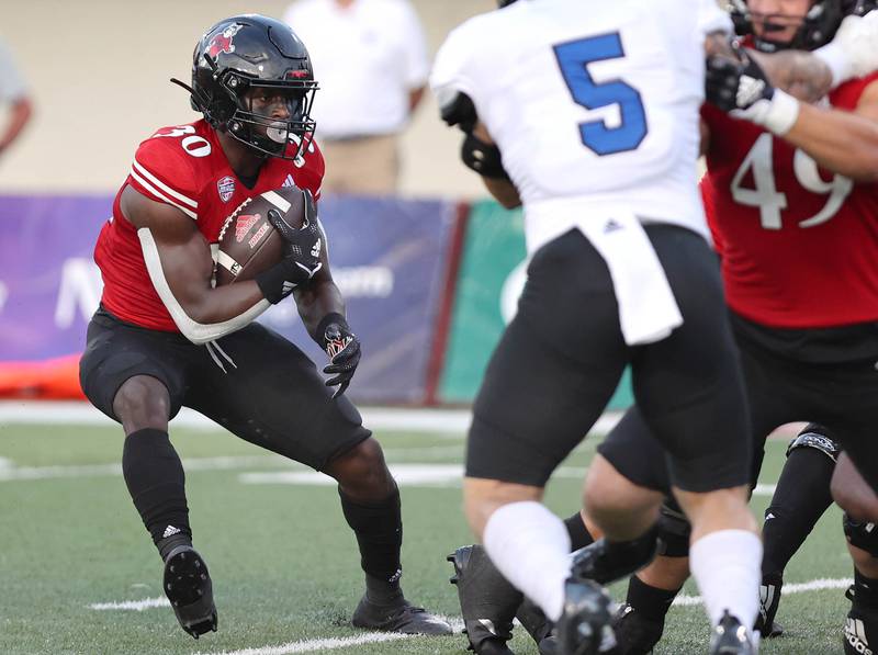 Northern Illinois Huskies running back Harrison Waylee looks to break to the outside of the Eastern Illinois defense during their game Thursday, Sept. 1, 2022, in Huskie Stadium at NIU.