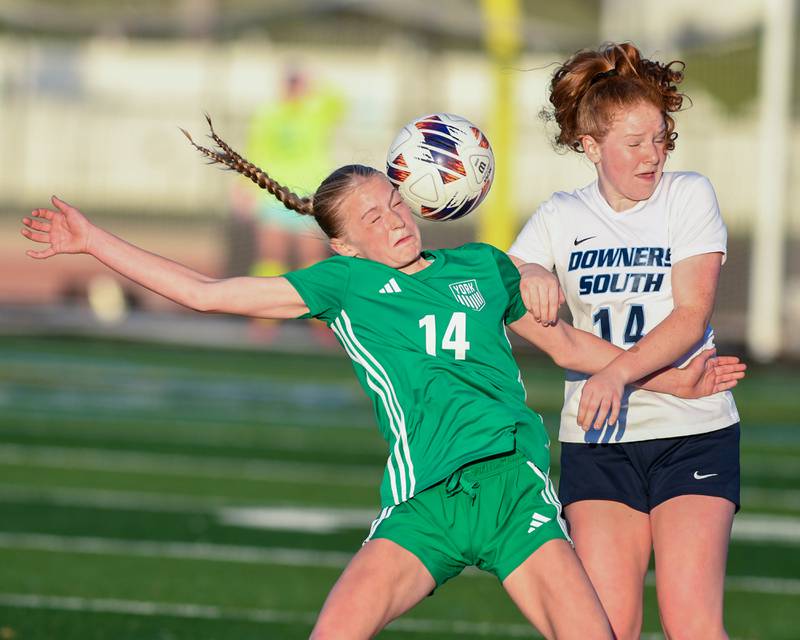 York's Maddie Schaefer, left, and Downers Grove South's Hannah Hake tries and head the ball during the game on Friday May 23, 2025, during the regional title game held at York High School.