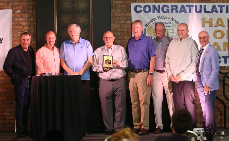 Members of the 1973-74 Marquette Boys Basketball Team, pose for a photo during the 2025 Shaw Media Illinois Valley Sports Hall of Fame at the Auditorium Ballroom in La Salle. The 1974 Marquette boys basketball team placed second in Class 1A .