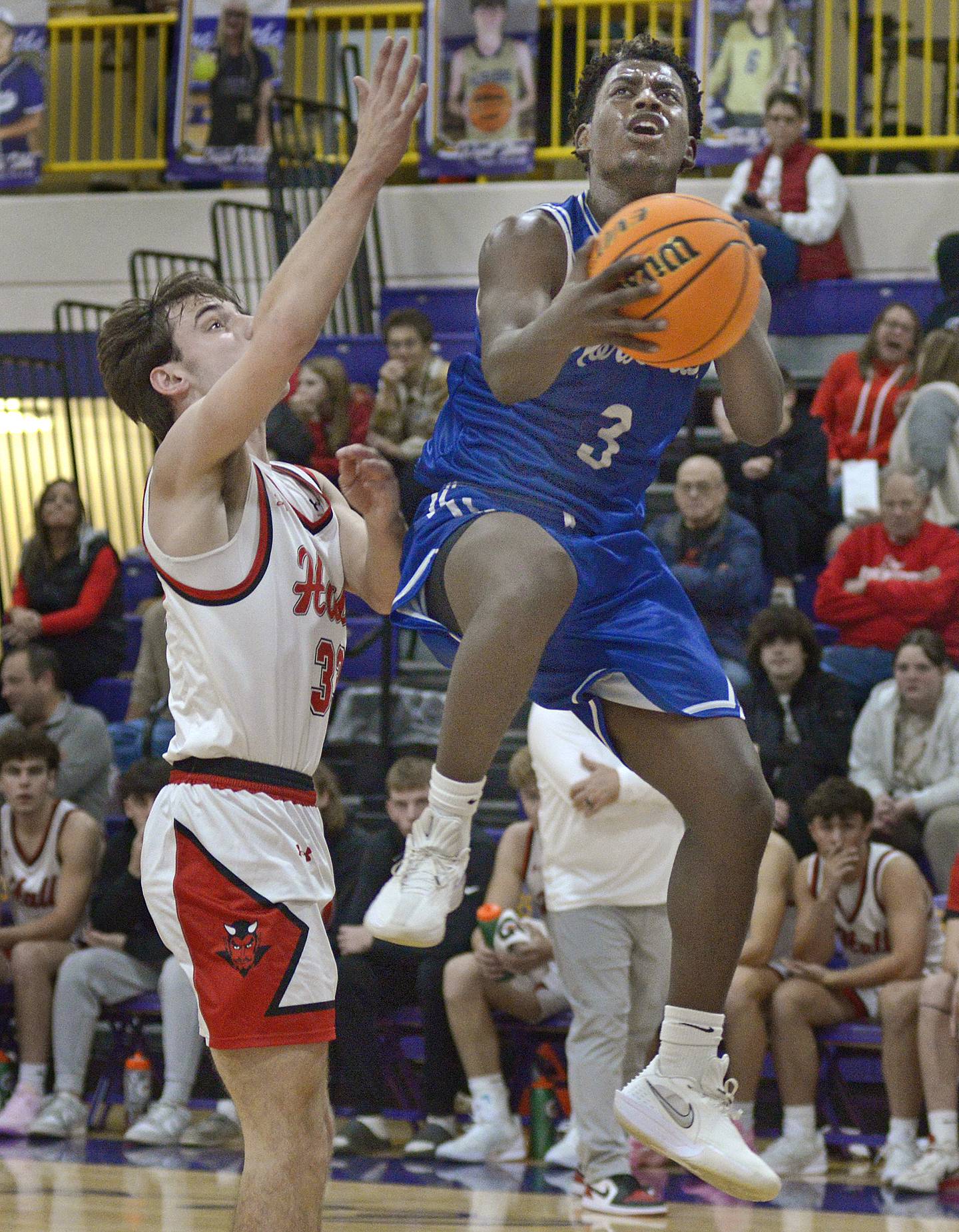 Newark’s Reggie Chapman gets up and over Hall’s Braden Curran to score late in the 2nd period Tuesday at Serena.