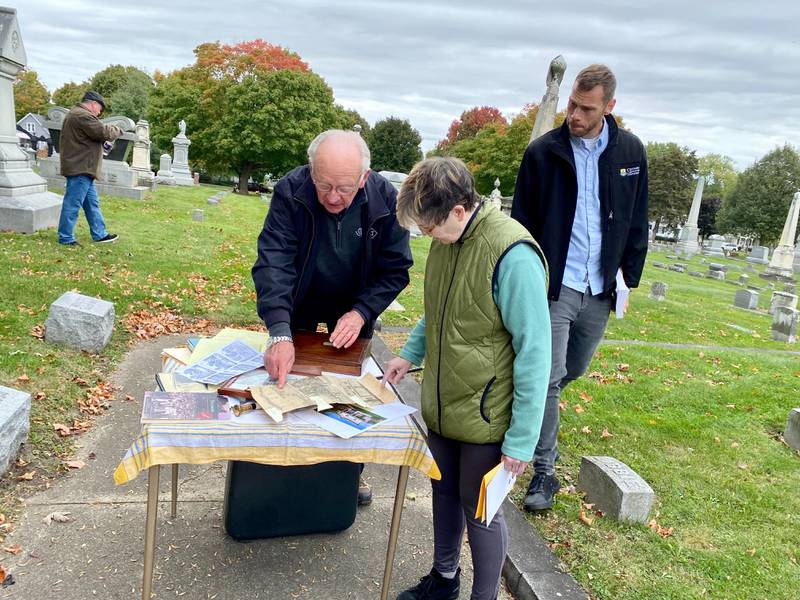 While community members look on, John Boies (left) gives information on his family, including descendant Henry Boies, who lived from 1830 to 1887 and was the Sycamore True Republican's editor, author and community leader. John Boies, president of the Elmwood Cemetery Company, spoke at the DeKalb County History Center’s annual Etched in Stone Cemetery Walk at Elmwood Cemetery, 901 S. Cross St., Sycamore on Sunday, Oct. 8, 2023.